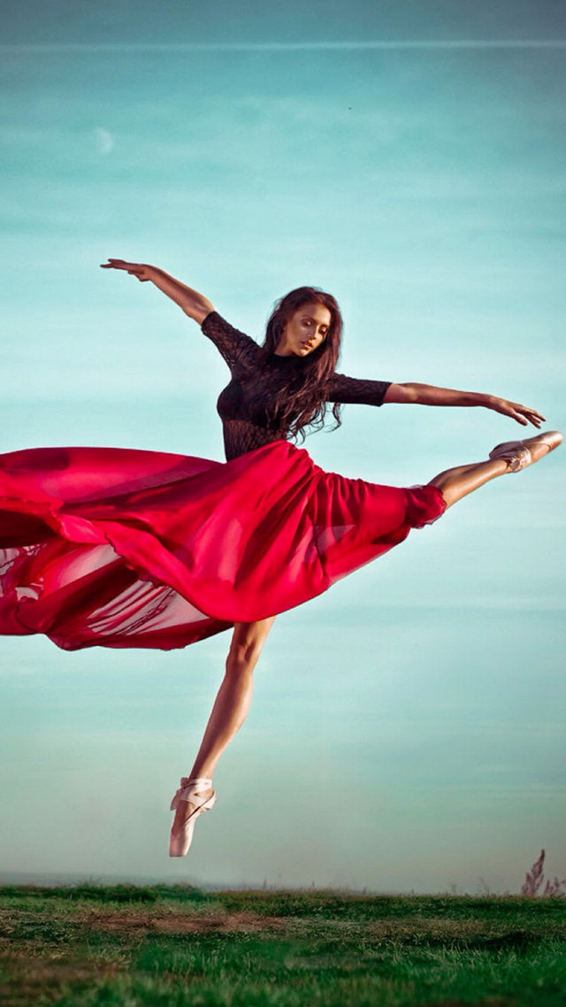 Woman red dress jumping arms free wallpaper - medium preview image