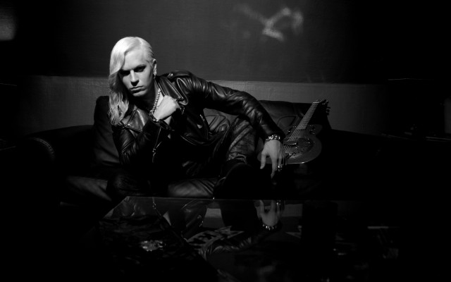 Man couch guitar black white free wallpaper - medium preview image