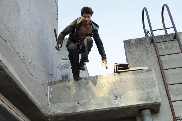 Man climbing concrete wall ladder free wallpaper - medium preview image