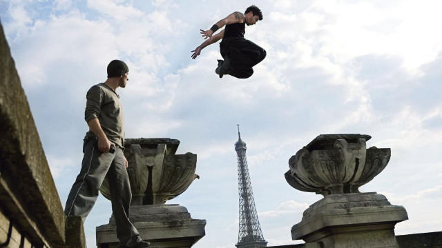 Man jumping off ledge eiffel free wallpaper - medium preview image