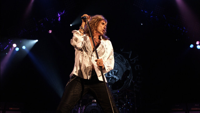 Man microphone stage concert lights free wallpaper - medium preview image