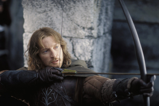 Man bow arrow stone wall free wallpaper - medium preview image