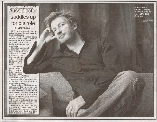 Man sitting couch newspaper hand free wallpaper - medium preview image
