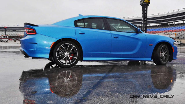 Blue sports car rainy day free wallpaper - medium preview image