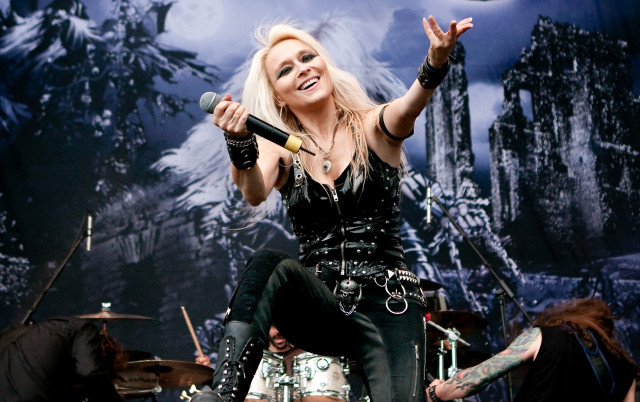 Woman black outfit stage microphone free wallpaper - medium preview image
