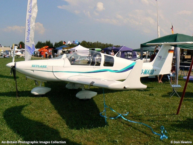 Small plane parked grass tents free wallpaper - medium preview image