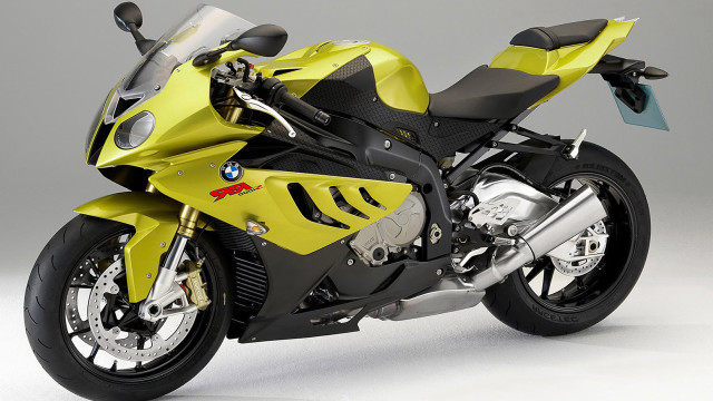 Yellow motorcycle white surface gray free wallpaper - medium preview image