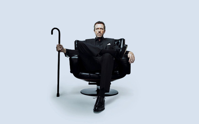 Man in suit chair umbrella free wallpaper - medium preview image