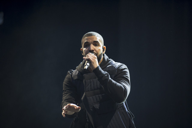 Man black jacket holding microphone free wallpaper - medium preview image