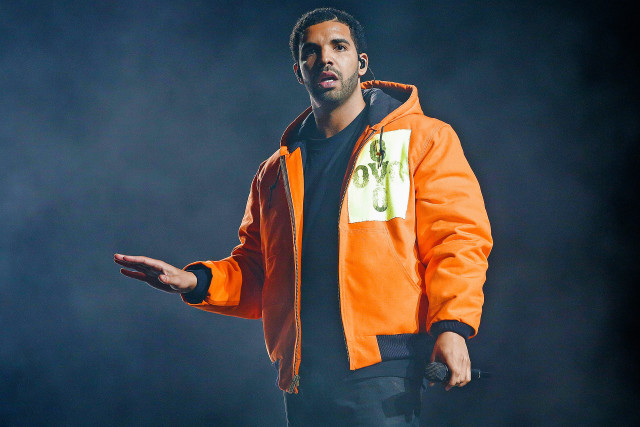Man orange jacket hands out free wallpaper - medium preview image