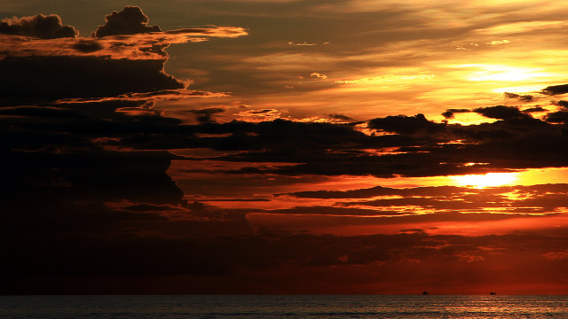 Sunset boat water clouds sky free wallpaper - medium preview image