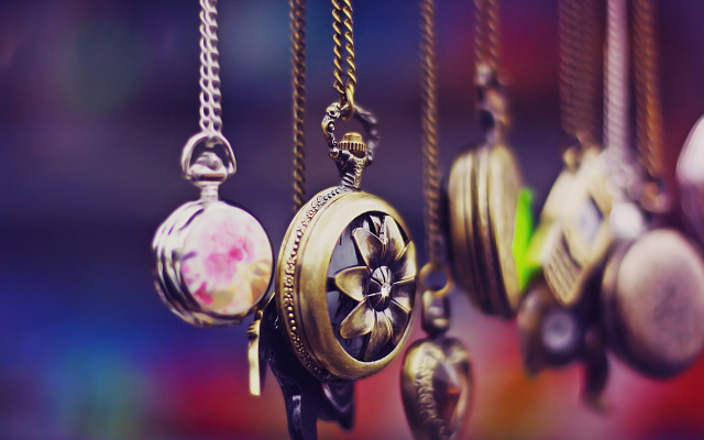 Colored clocks hanging chains wall free wallpaper - medium preview image