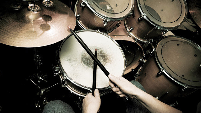 Person holding drums drum set free wallpaper - medium preview image