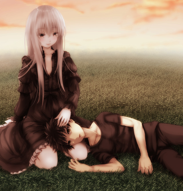 Couple laying lush green field free wallpaper - medium preview image