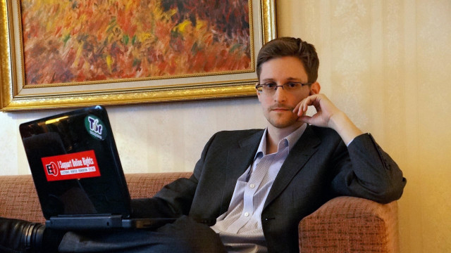 Man sitting couch laptop phone free wallpaper - medium preview image