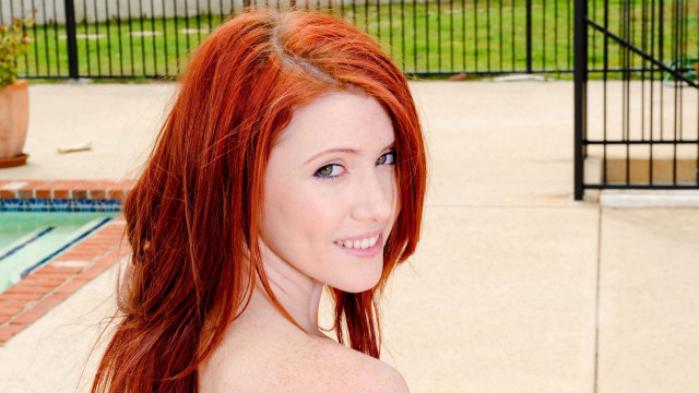 Woman red hair pool fence free wallpaper - medium preview image