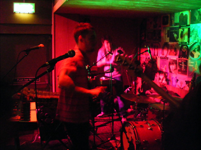 Band playing dimly lit room free wallpaper - medium preview image