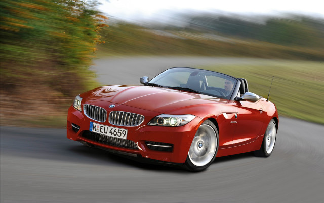 Red convertible driving forest hills #2 free wallpaper - medium preview image