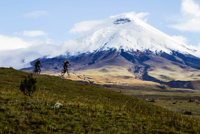 Mountain bikers snow capped peak free wallpaper - medium preview image
