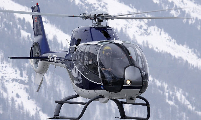 Helicopter flying snow covered mountain free wallpaper - medium preview image