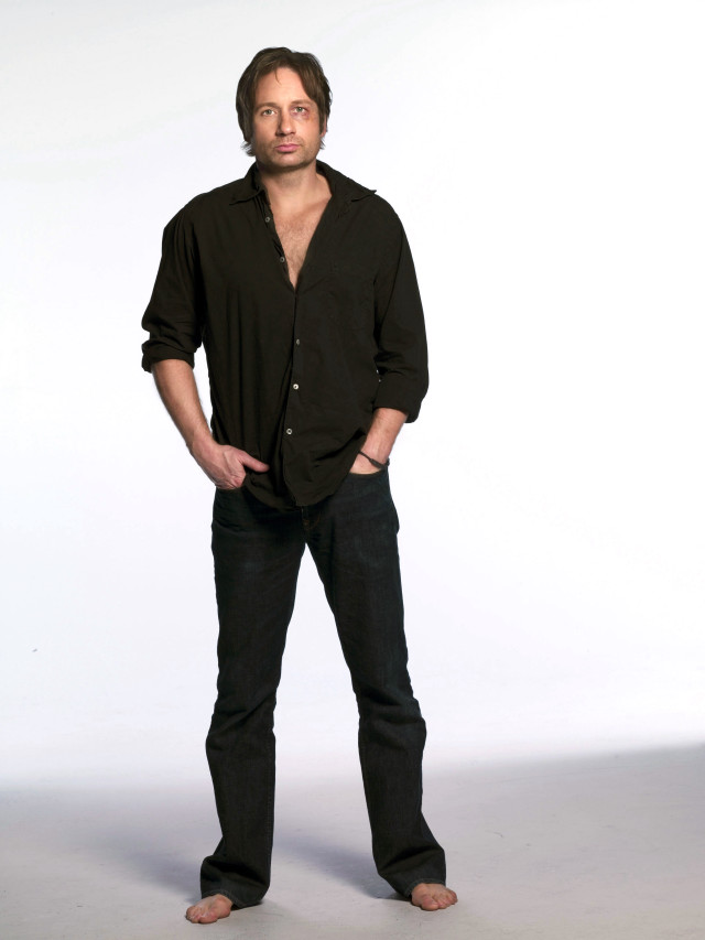 Man standing hands in pockets #2 free wallpaper - medium preview image