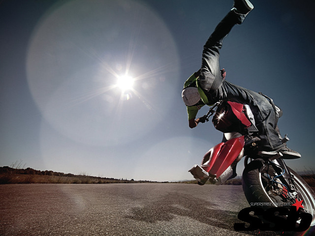 Motorcycle trick person hands air free wallpaper - medium preview image