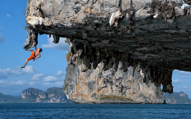 Man hanging cliff climbing water free wallpaper - medium preview image