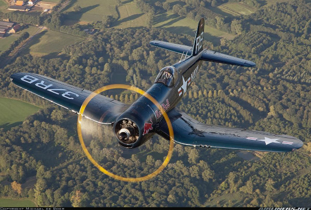 Small airplane flying lush green free wallpaper - medium preview image
