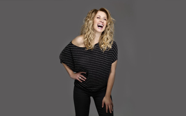 Woman laughing hands on hips free wallpaper - medium preview image