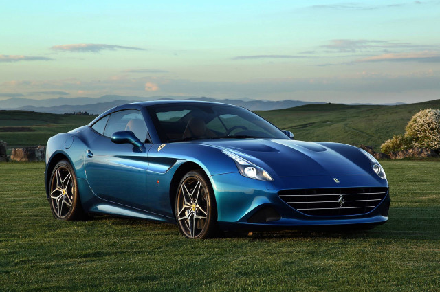 Blue sports car field mountains free wallpaper - medium preview image