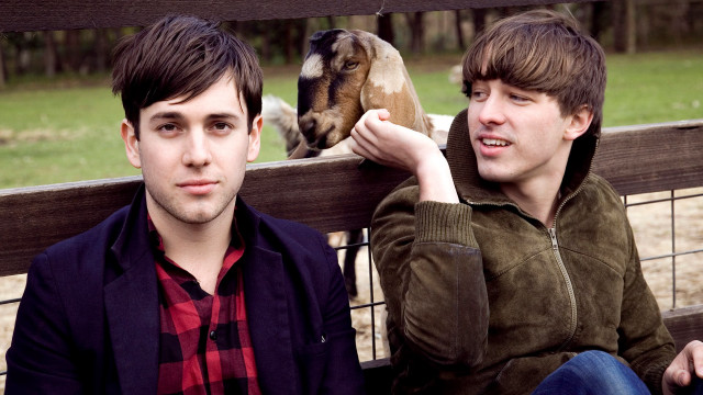 Young men bench goat behind free wallpaper - medium preview image