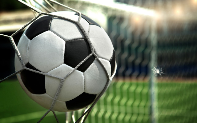Soccer ball stuck net field free wallpaper - medium preview image