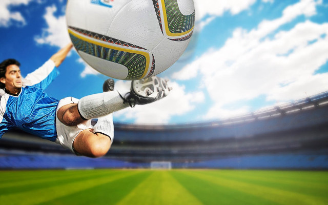 Man kicking soccer ball grass #2 free wallpaper - medium preview image