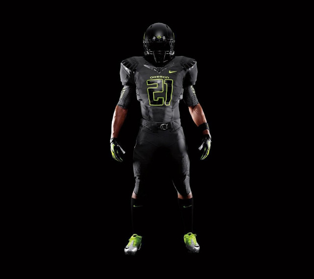 Football player black uniform green free wallpaper - medium preview image