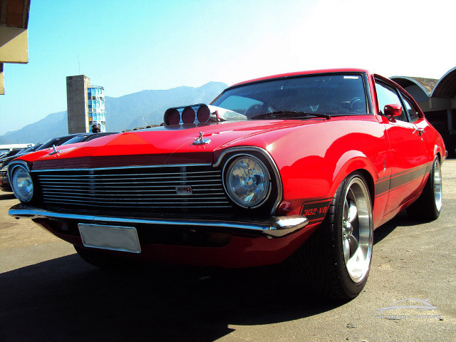 Red car parking lot mountain free wallpaper - medium preview image