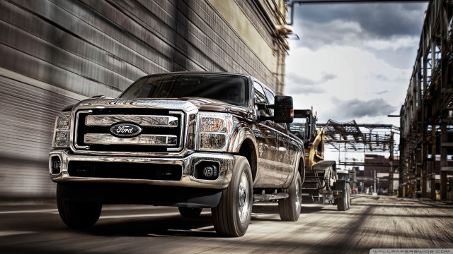 Truck driving street building construction free wallpaper - medium preview image