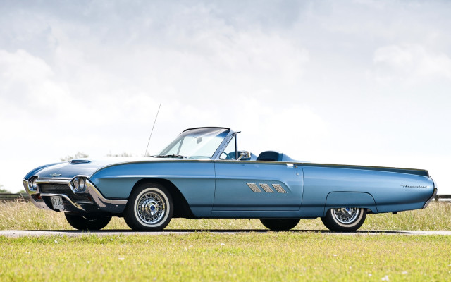 Blue convertible car grass field free wallpaper - medium preview image
