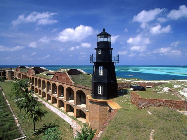 Lighthouse brick wall ocean beach free wallpaper - medium preview image