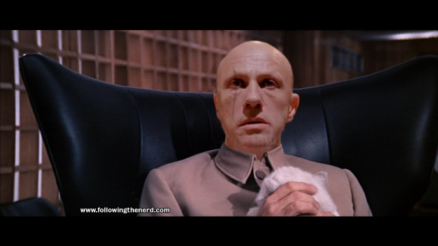 Bald man suit tie chair free wallpaper - medium preview image