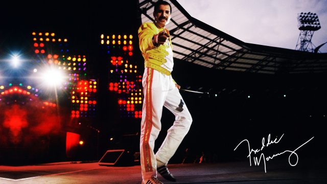 Man yellow shirt stage microphone free wallpaper - medium preview image