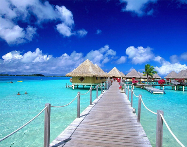 Pier beach thatched huts boat free wallpaper - medium preview image