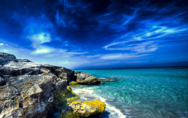Rocky beach blue sky water free wallpaper - medium preview image