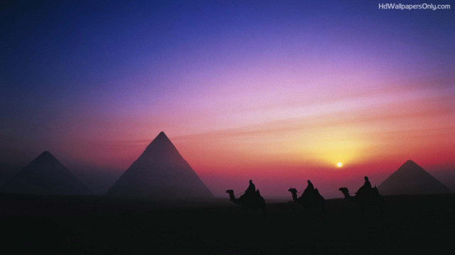 Camel riders desert sunset pyramids free wallpaper - medium preview image