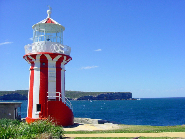 Red white lighthouse green field free wallpaper - medium preview image