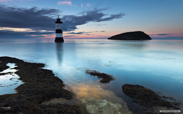 Lighthouse rocky beach ocean sunset free wallpaper - medium preview image