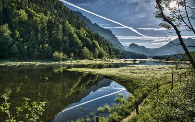 Lake mountains trees smoke sky free wallpaper - medium preview image