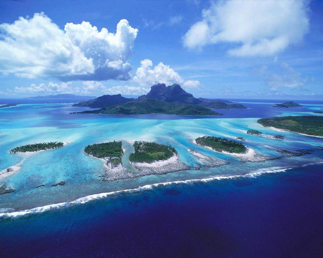 Small islands ocean sky clouds free wallpaper - medium preview image