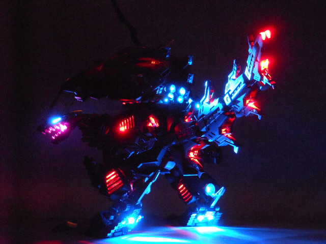Toy robot lights dark background free wallpaper - medium preview image