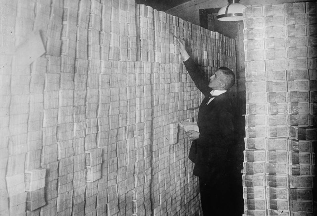 Man suit leaning wall stacks free wallpaper - medium preview image