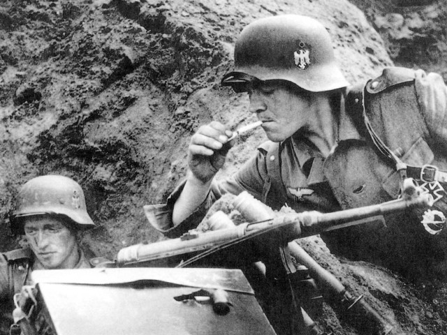 Soldier gun smoking cigarette field free wallpaper - medium preview image